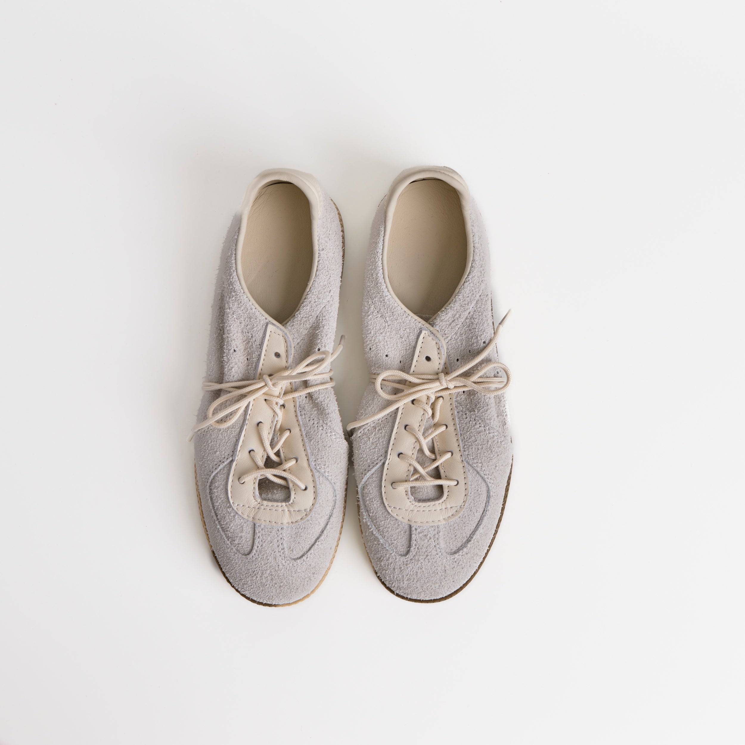 The Dual Stride White Flexible Sheepskin Suede Sneakers