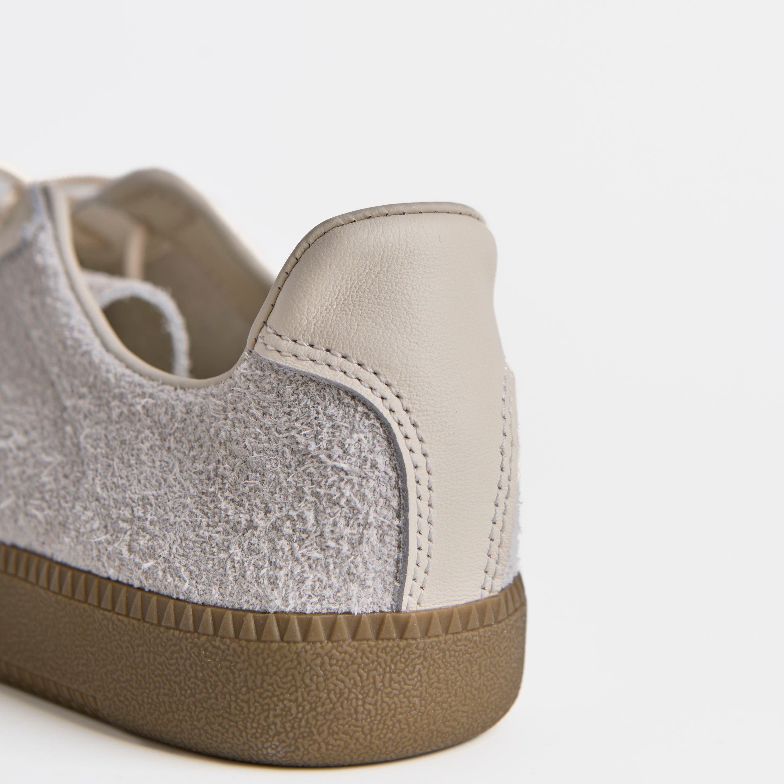 The Dual Stride White Flexible Sheepskin Suede Sneakers