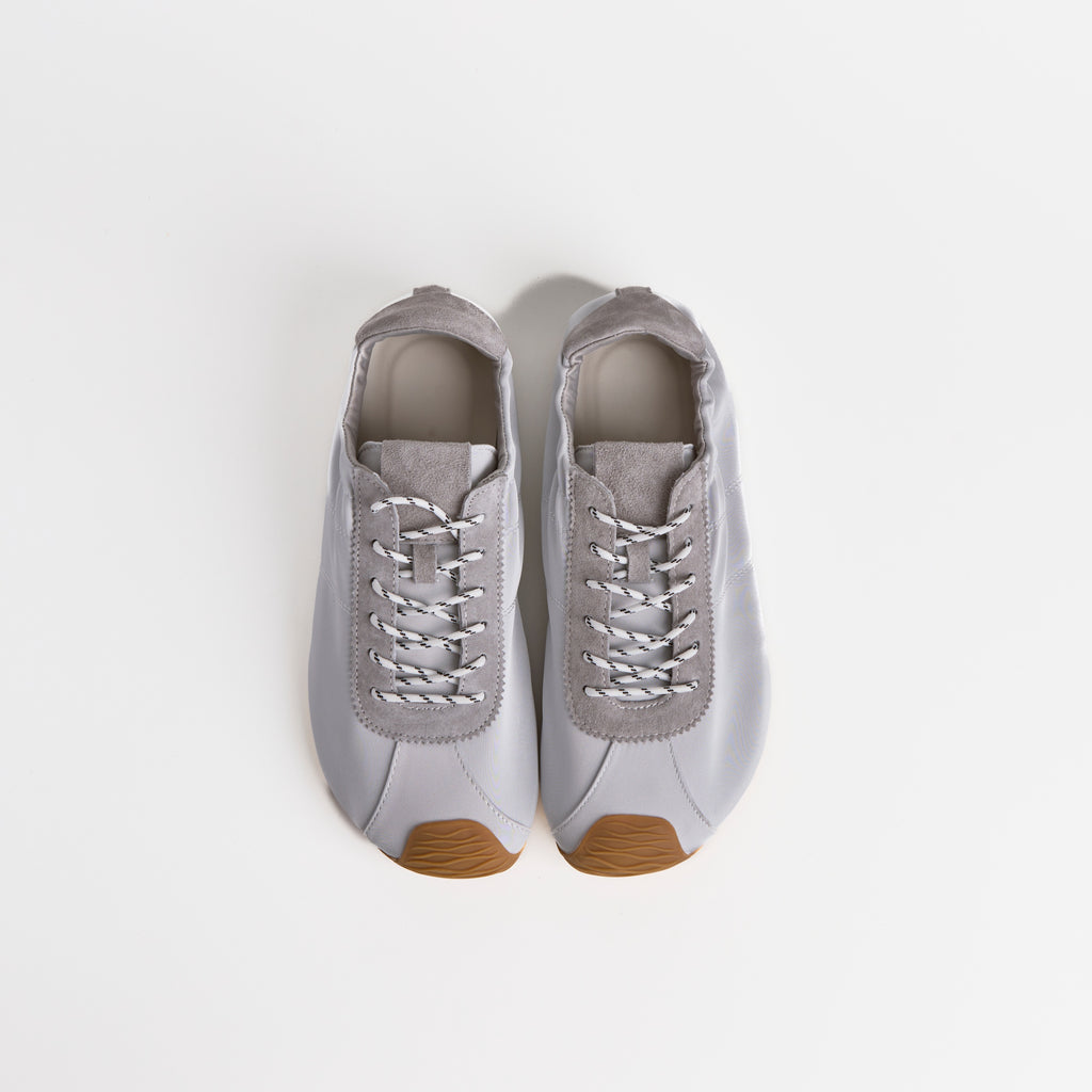 The Dual Stride Gray Square-Toe  Satin Trainer