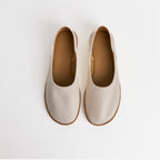 Los zapatos slip-on de cuero blancos minimalistas Dual Stride