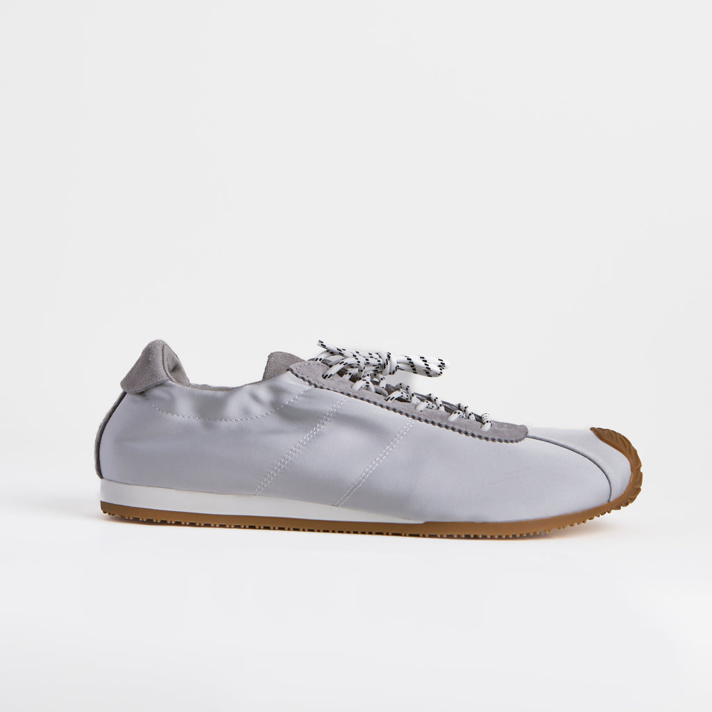 The Dual Stride Gray Square-Toe  Satin Trainer