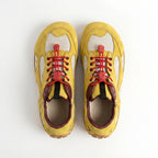 Las zapatillas deportivas casuales amarillas Dual Stride para mujer