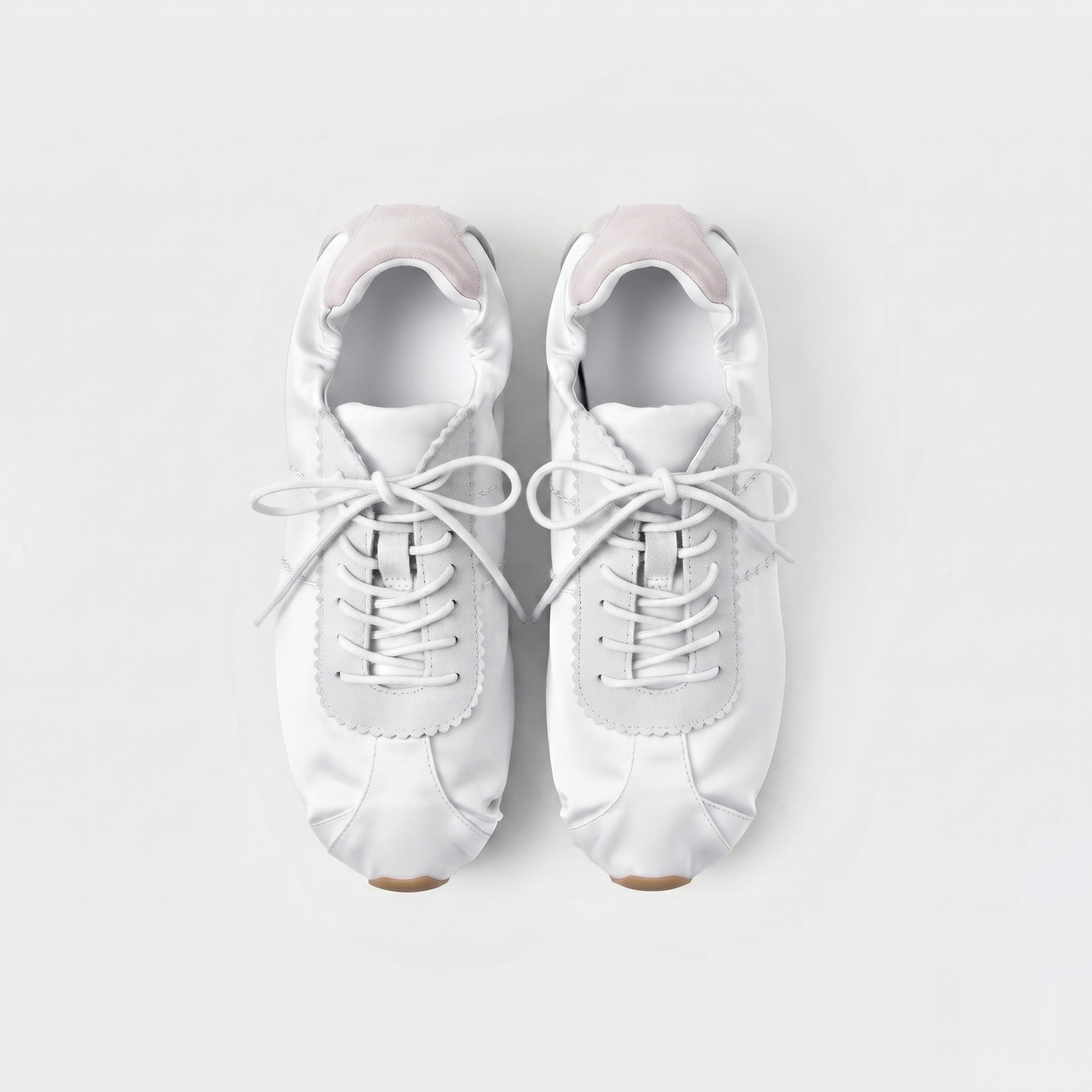 The Dual Stride Women‘s White Satin Ballet Trainers