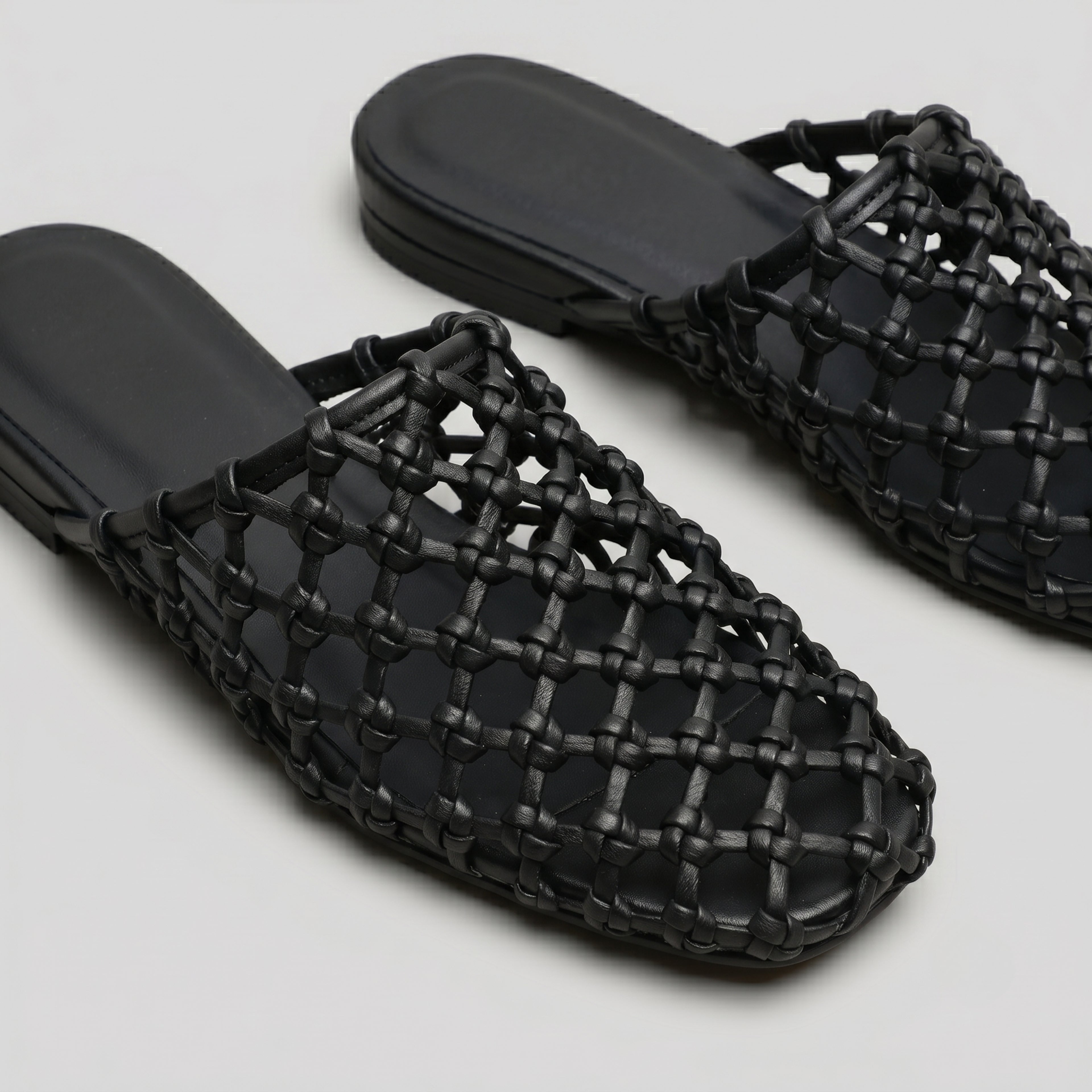 The Dual Stride Women's Black Woven Leather Mule